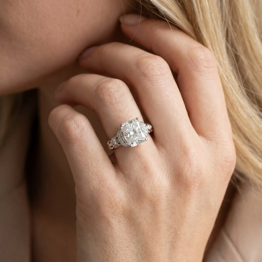 White gold Radiant Cut Diamond Solitaire Ring with Filigree Band and Four-Prong Setting