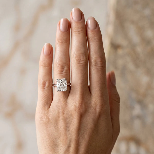 White gold Radiant Cut Diamond Solitaire Ring with Thin Band and Four-Prong Setting