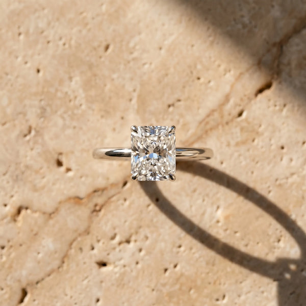 White gold Radiant Cut Diamond Solitaire Ring with Thin Band and Four-Prong Setting