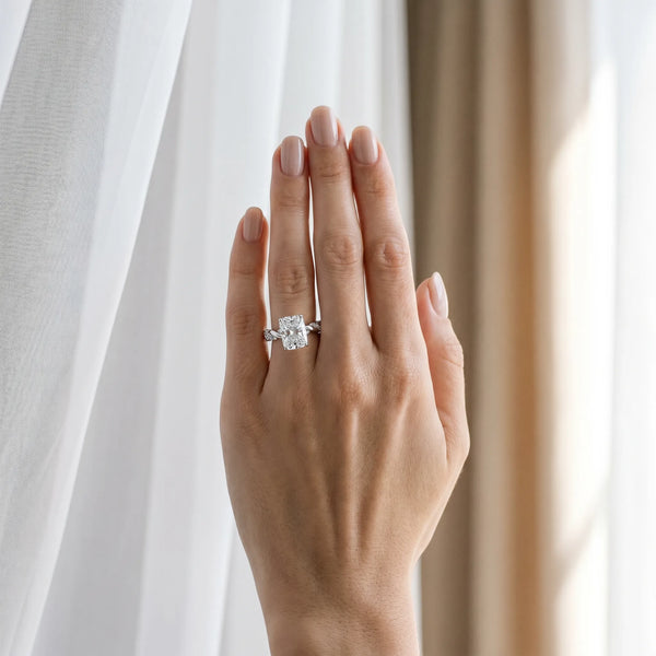 White gold Radiant Cut Diamond Solitaire Ring with Twisted Band and Pavé Accents