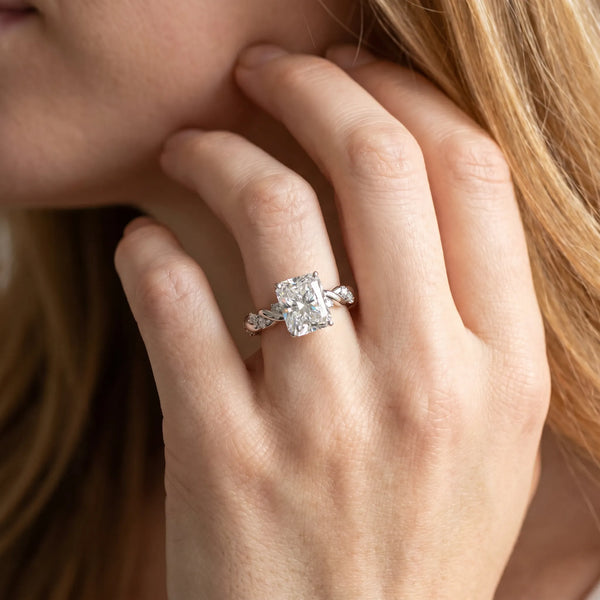White gold Radiant Cut Diamond Solitaire Ring with Twisted Band and Pavé Accents