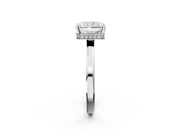 White gold Radiant Cut Solitaire Engagement Ring with Four-Prong Setting on a Classic Band