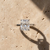 White gold Radiant Cut Solitaire Engagement Ring with Four-Prong Setting on a Classic Band_85