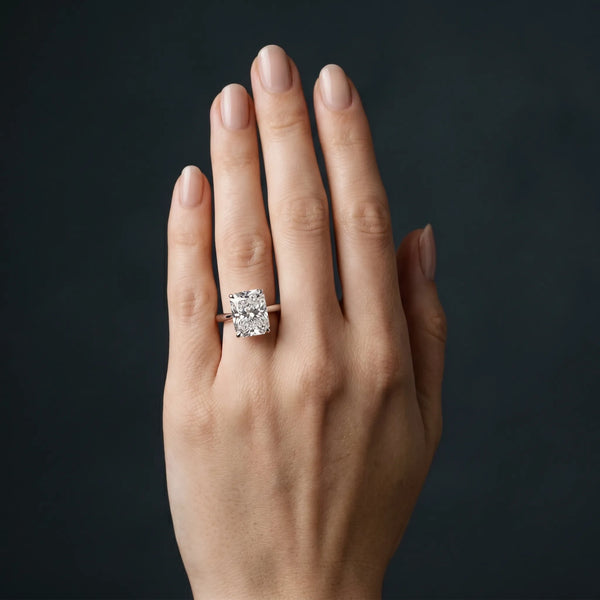 White gold Radiant Cut Solitaire Ring with Cathedral Band and Four-Prong Setting