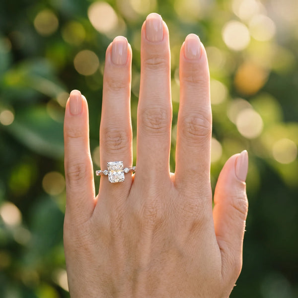 White gold Radiant Solitaire Diamond Ring with Bezel Set Side Stones and Prong Setting