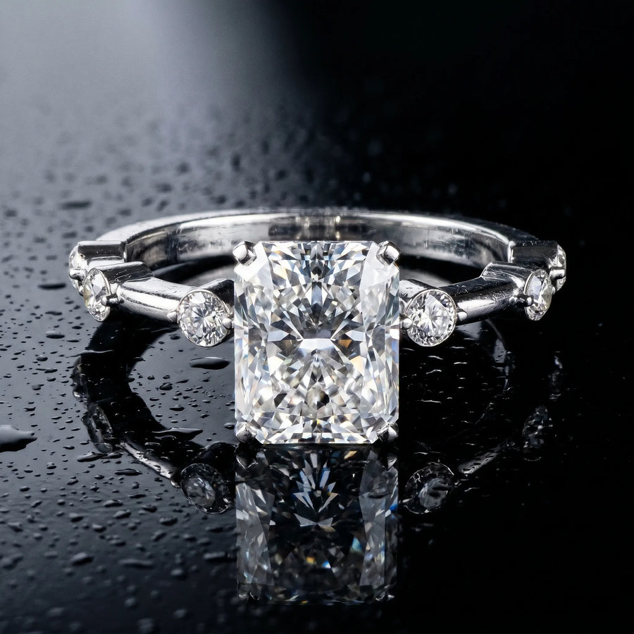 White gold Radiant Solitaire Diamond Ring with Bezel Set Side Stones and Prong Setting