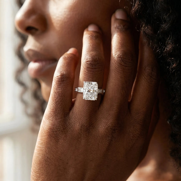 White gold Radiant Solitaire Diamond Ring with Channel-Set Baguette Band and Four-Prong Setting
