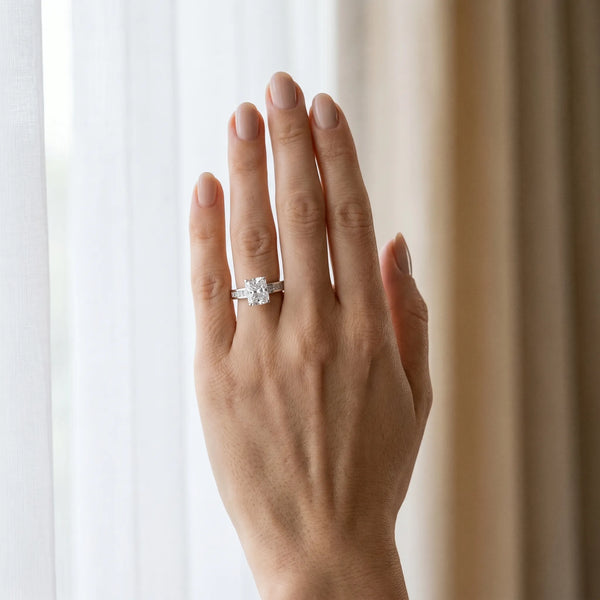 White gold Radiant Solitaire Diamond Ring with Channel-Set Band and Four-Prong Setting