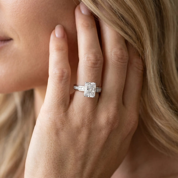 White gold Radiant Solitaire Diamond Ring with Channel-Set Band and Four-Prong Setting