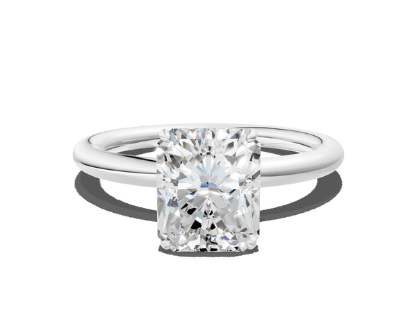 White gold Radiant Solitaire Diamond Ring with Four-Prong Setting on a Plain Band