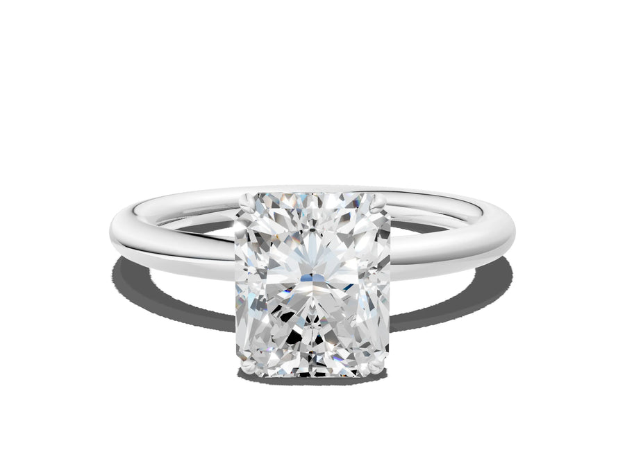 White gold Radiant Solitaire Diamond Ring with Four-Prong Setting on a Plain Band