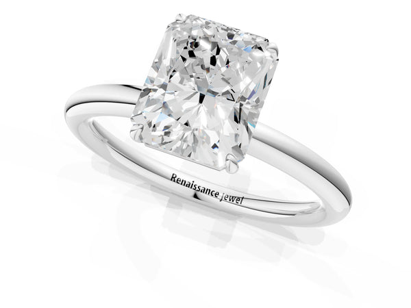 White gold Radiant Solitaire Diamond Ring with Four-Prong Setting on a Plain Band