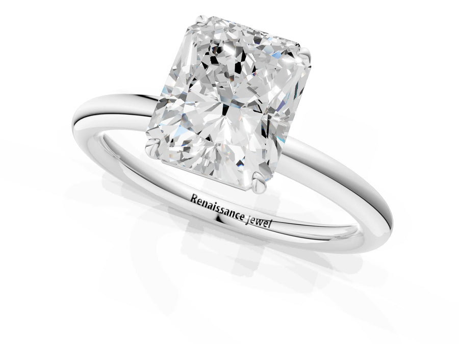 White gold Radiant Solitaire Diamond Ring with Four-Prong Setting on a Plain Band