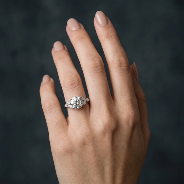 White gold Round Brilliant Cluster Diamond Ring with Marquise and Round Cut Stones on a Classic Band with Four-Prong Setting