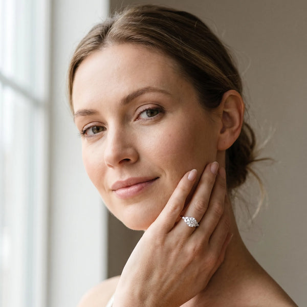 White gold Round Brilliant Cluster Diamond Ring with Marquise and Round Cut Stones on a Classic Band with Four-Prong Setting