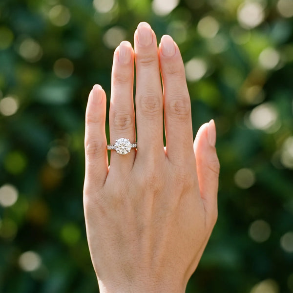 White gold Round Brilliant Cut Diamond Engagement Ring with Pavé Band and Four-Prong Setting