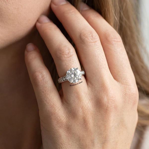 White gold Round Brilliant Cut Diamond Engagement Ring with Pavé Band and Four-Prong Setting