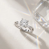 White gold Round Brilliant Diamond Solitaire with Marquise Side Stones on a Twisted Band and Four-Prong Setting_31