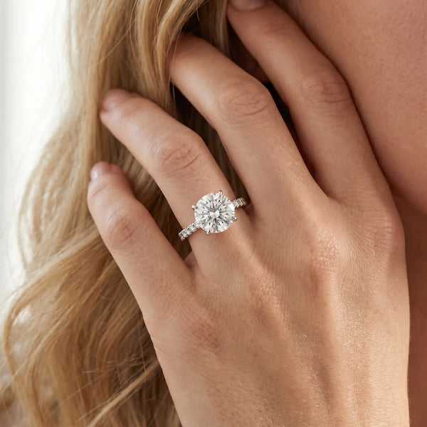 White gold Round Brilliant Diamond Solitaire with Pavé Band and Four-Prong Setting