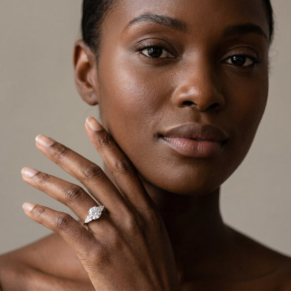 White gold Round Brilliant Diamond Solitaire with Side Stones on a Tapered Band and Four-Prong Setting