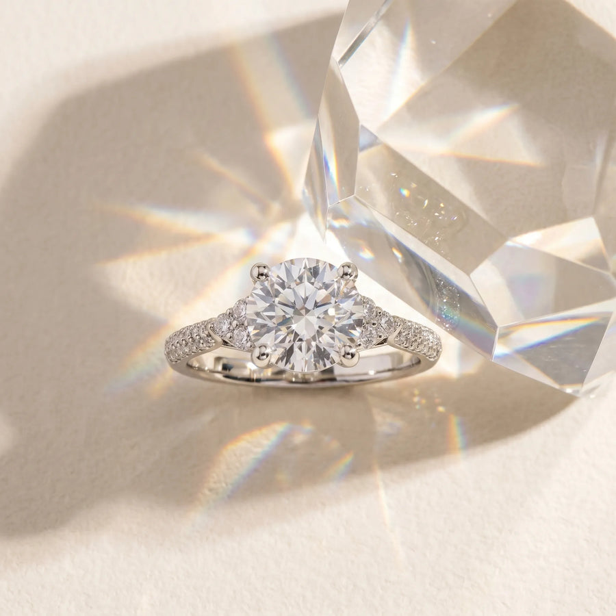 White gold Round Brilliant Pave Diamond Engagement Ring with Cathedral Band and Four-Prong Setting