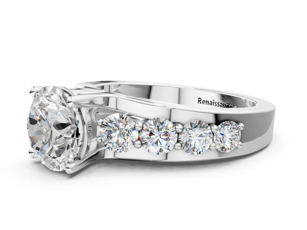 White gold Round Brilliant Solitaire with Side Stones on a Pave Band and Four-Prong Setting