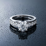 White gold Round Brilliant Solitaire with Side Stones on a Pave Band and Four-Prong Setting_157