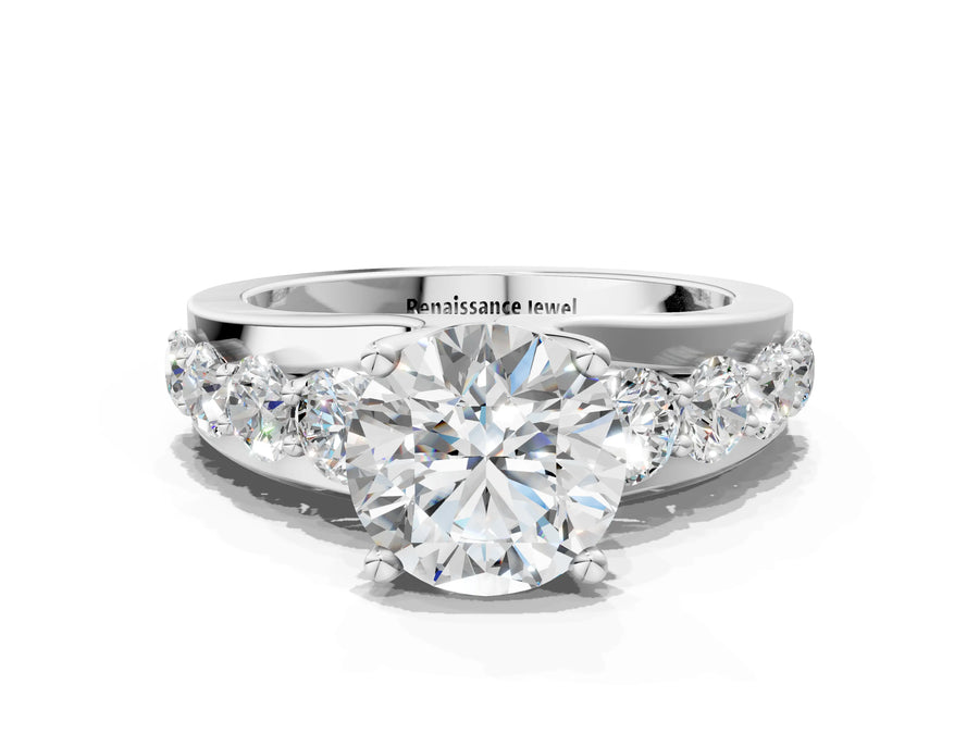 White gold Round Brilliant Solitaire with Side Stones on a Pave Band and Four-Prong Setting