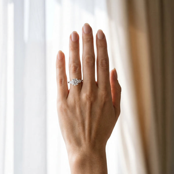 White gold Round Brilliant Three-Stone Diamond Ring with Pavé Band and Four-Prong Setting