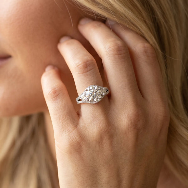 White gold Round Brilliant Three-Stone Diamond Ring with Pavé Band and Prong Setting