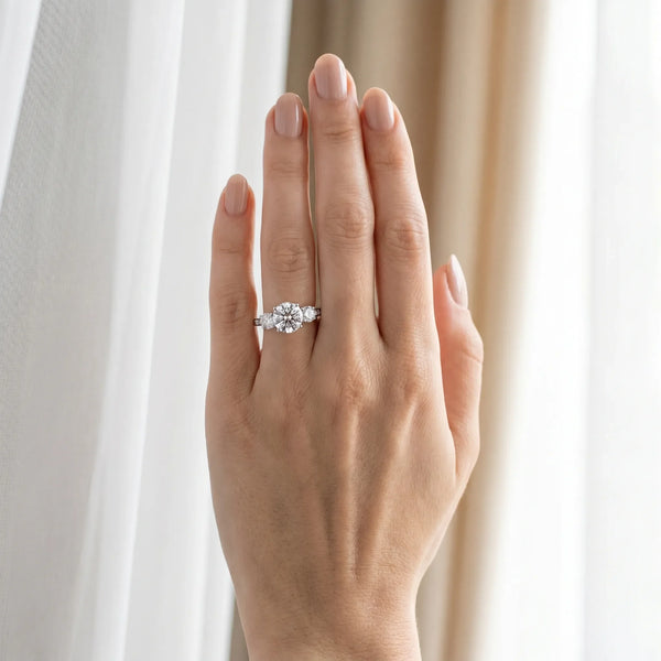 14K White Gold 1.42 Carat E VVS2 Round Brilliant Three-Stone Engagement Ring with Split Shank and Prong Setting