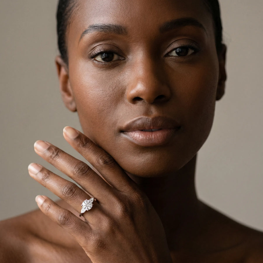 White gold Round Brilliant Three-Stone Ring with Pear Side Stones and Four-Prong Setting
