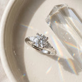 White gold Round Brilliant Three-Stone Ring with Pear Side Stones and Four-Prong Setting_24