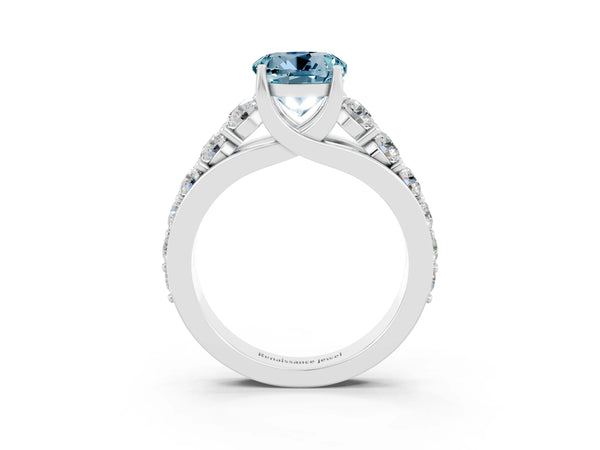 Platinum Round Cut Aquamarine Engagement Ring with Pavé Band and Four-Prong Setting