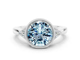 White gold Round Cut Aquamarine Halo Ring with Tapered Band and Four-Prong Setting