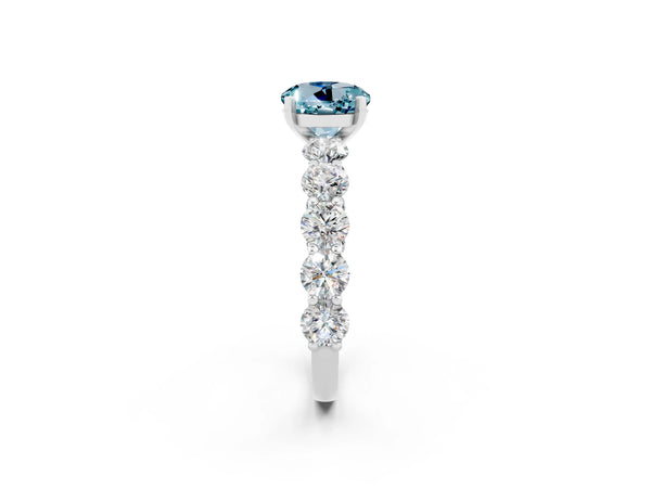White gold Round Cut Aquamarine Prong Setting with Side Stones on a Pave Band