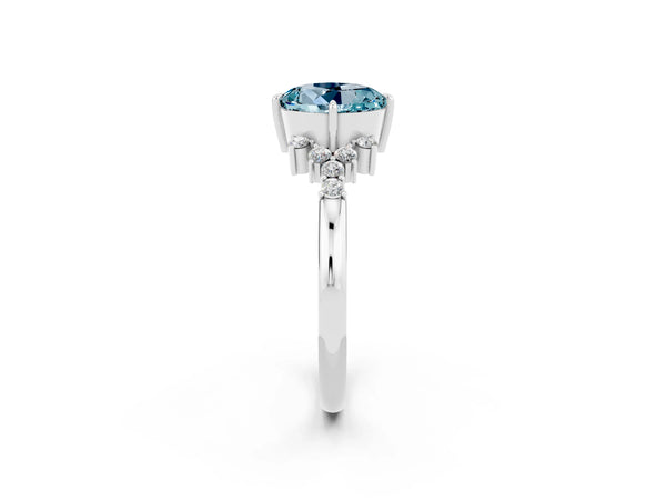Platinum Round Cut Aquamarine Ring with Side Stones and Four-Prong Setting