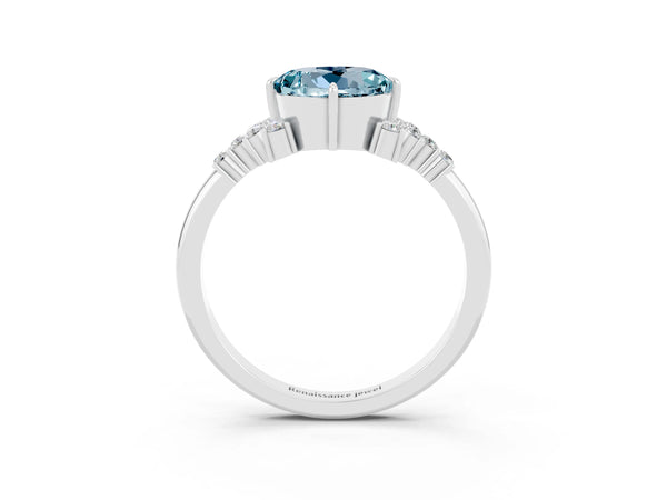 Platinum Round Cut Aquamarine Ring with Side Stones and Four-Prong Setting