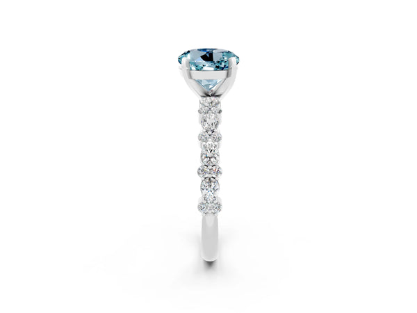 Platinum Round Cut Aquamarine Side Stone Solitaire Ring with Round  and Four-Prong Setting