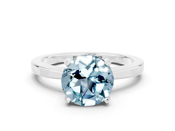 Platinum Round Cut Aquamarine Solitaire Engagement Ring with Classic Band and Four-Prong Setting