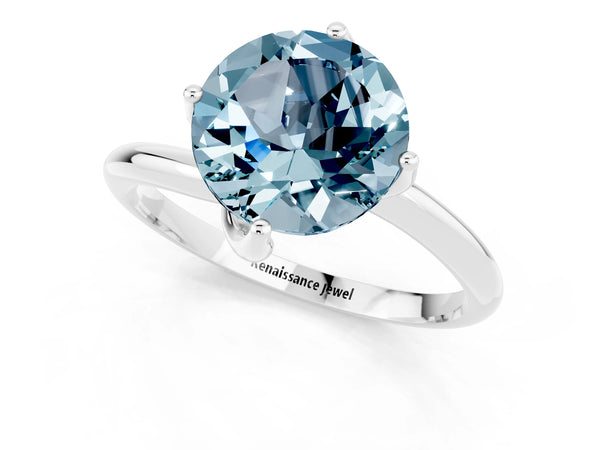 Silver Round Cut Aquamarine Solitaire Engagement Ring with Four-Prong Setting and Classic Band