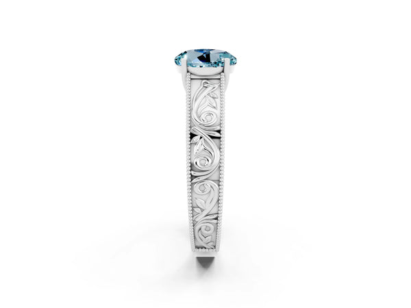 Silver Round Cut Aquamarine Solitaire Ring with Engraved Band and Four-Prong Setting