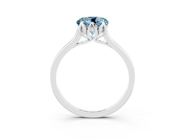 Platinum Round Cut Aquamarine Solitaire Ring with Flower Prong Setting and Classic Band