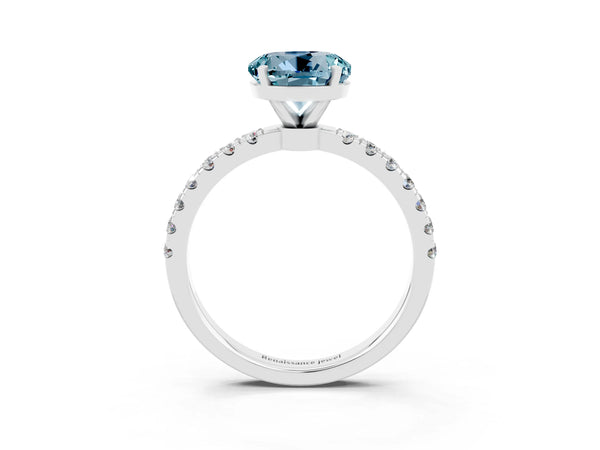 Platinum Round Cut Aquamarine Solitaire Ring with Pavé Accents and Four-Prong Setting
