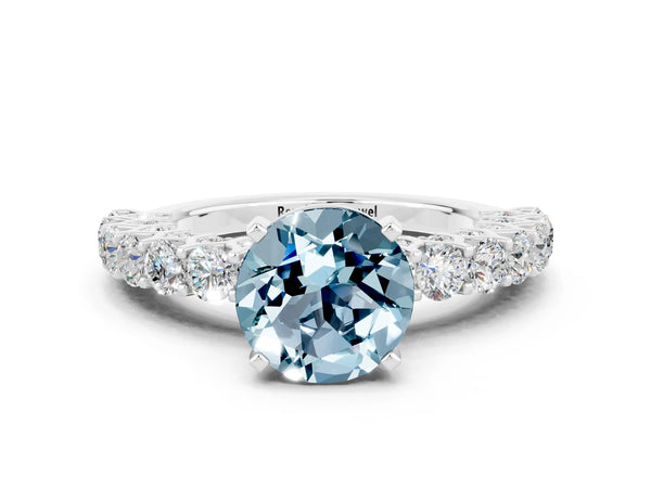 White gold Round Cut Aquamarine Solitaire Ring with Shared Prong Pavé Band and Four-Prong Setting