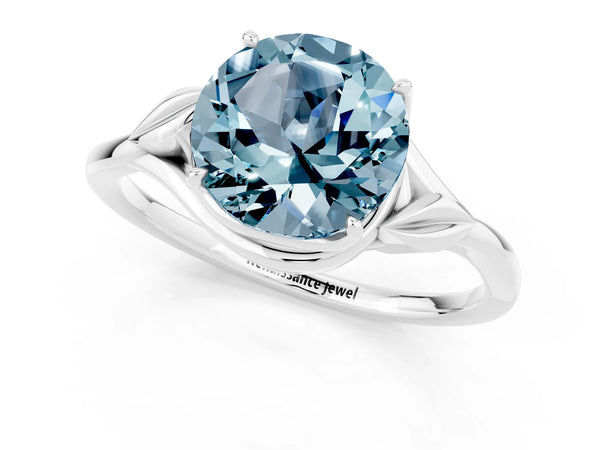 Platinum Round Cut Aquamarine Solitaire Ring with Twist Band and Four-Prong Setting