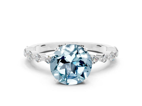 White gold Round Cut Aquamarine Solitaire with Side Stones on a Pavé Band and Four-Prong Setting