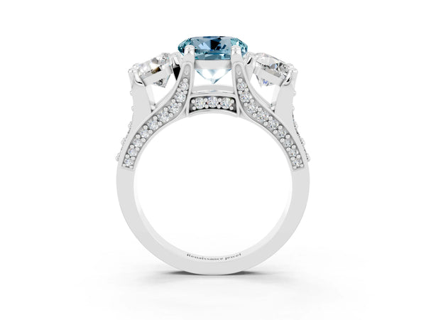 Platinum Round Cut Aquamarine Three-Stone Ring with Channel Set Band and Four-Prong Setting