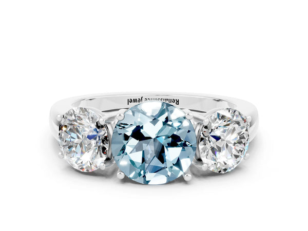 Platinum Round Cut Aquamarine Three-Stone Ring with Four-Prong Setting and Classic Band