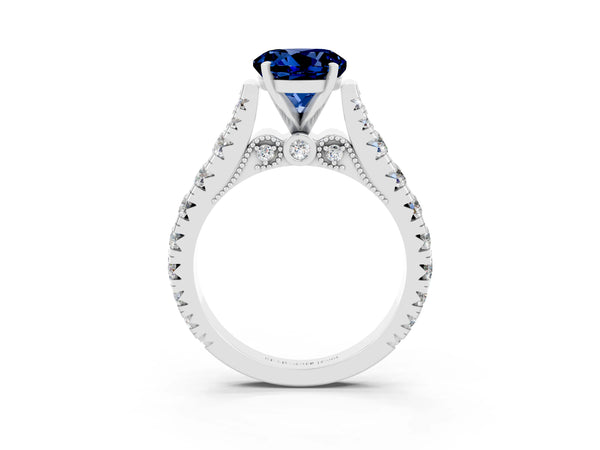 Platinum Round Cut Blue Sapphire Classic Solitaire Ring with Pavé Band and Four-Prong Setting